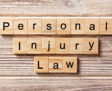 personal injury law word written on wood block. personal injury law text on table, concept.